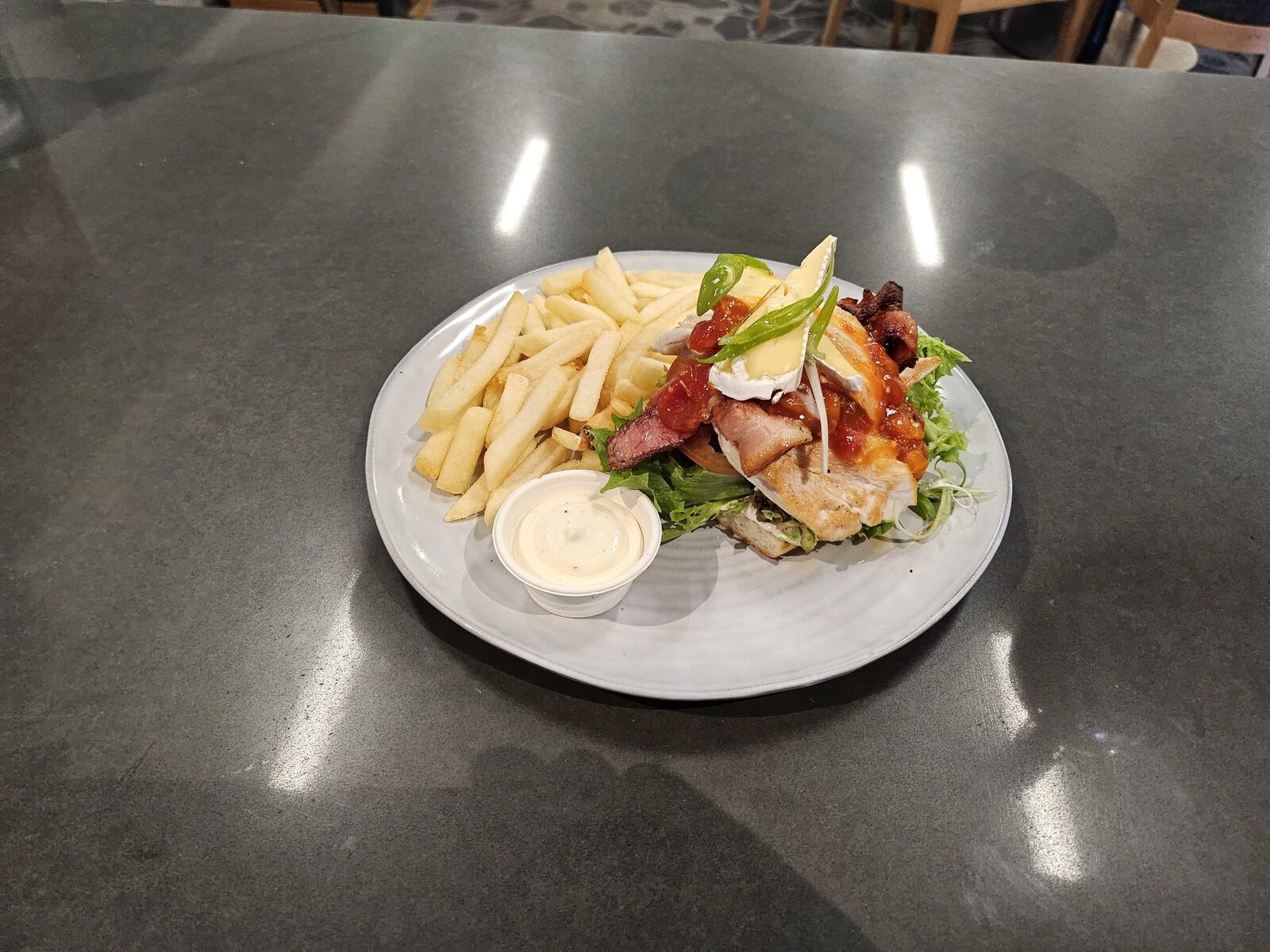 Grilled chicken and bacon stack with fries and aioli